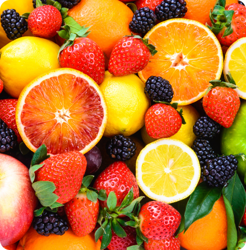 Assorted colourful whole and sliced fruit