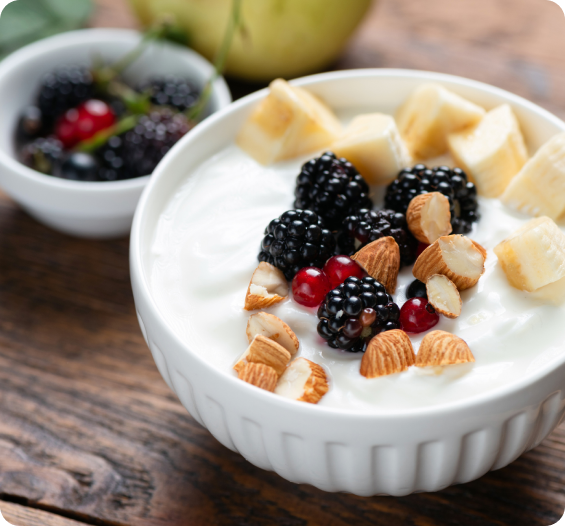 Bowl of yoghurt topped with fresh fruit