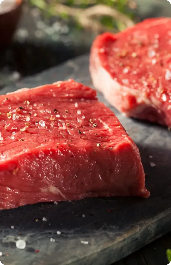 Close view of seasoned raw red meat
