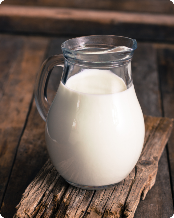 Glass jug filled with milk