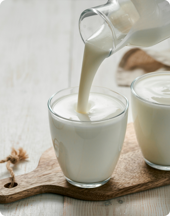 Milk being poured into a cup