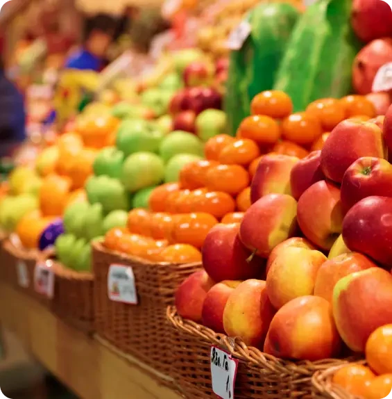 An assortment of fresh fruit displayed in market baskets