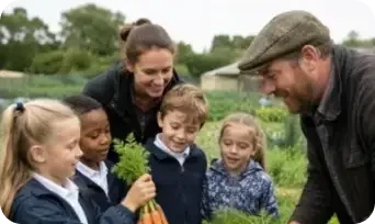 Farmer teaching five primary school children outdoors in a field, holding fresh carrots during a farm education visit