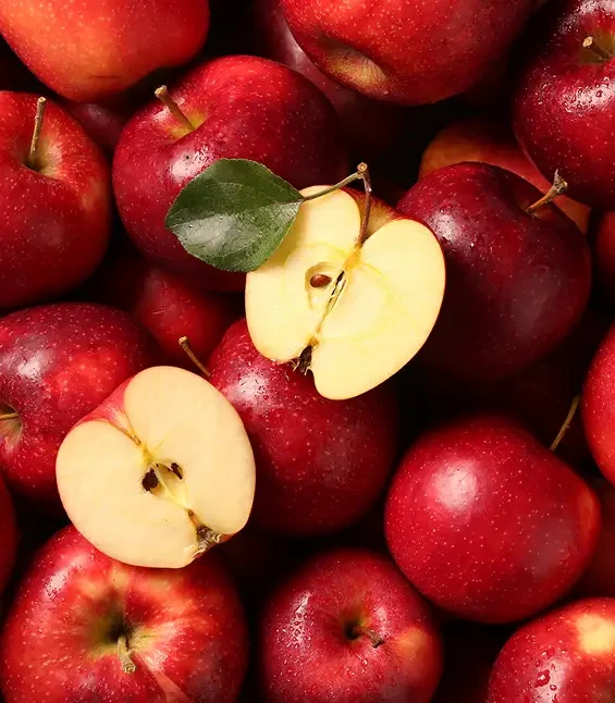 Whole and halved red apples