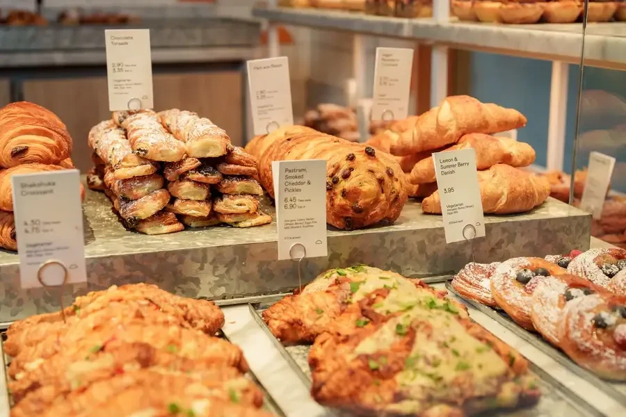 Selection of pastries displayed at a bakery counter