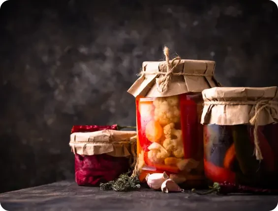 Preserve jars covered with paper and tied with string