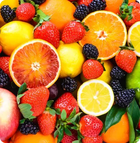 A colourful selection of citrus fruit, berries and apples