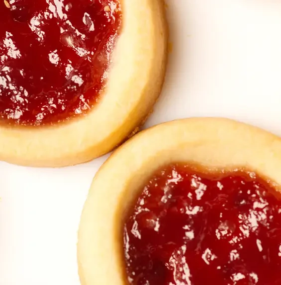 Round biscuits with red jam centres