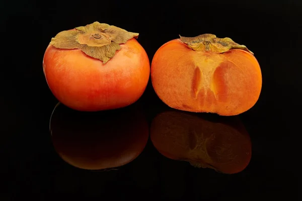 Whole and cut Fuyu persimmons