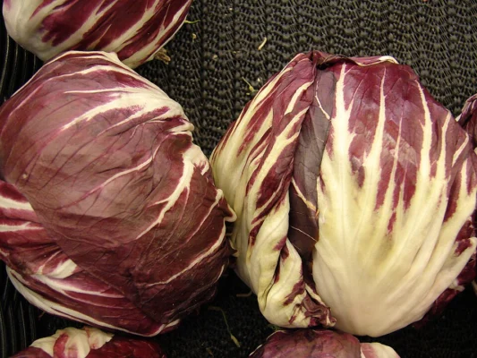 Harvested radicchio heads on a produce display