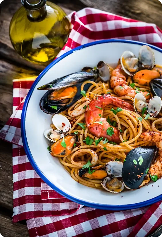 A bowl of spaghetti with prawns, mussels and other seafood